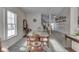 Bright dining room with carpet flooring and view of staircase and living area at 387 Legacy Blvd, Greenwood, IN 46143