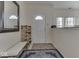 Bright entryway with white door, decorative rug, shoe rack, bench, and natural light at 387 Legacy Blvd, Greenwood, IN 46143