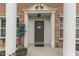 The home's front entry shows brick facade, decorative door frame and an elegant door at 387 Legacy Blvd, Greenwood, IN 46143