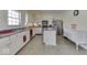 Spacious kitchen with white cabinets, stainless steel appliances, and a center island at 387 Legacy Blvd, Greenwood, IN 46143