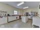 Well-lit kitchen features white cabinets, stainless steel appliances, and ample counter space at 387 Legacy Blvd, Greenwood, IN 46143