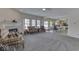 Comfortable living room featuring a fireplace, plush furniture, and large windows at 387 Legacy Blvd, Greenwood, IN 46143