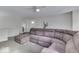Open-concept living area with a huge sectional sofa and ceiling fan at 387 Legacy Blvd, Greenwood, IN 46143