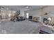 Spacious living room with fireplace, carpet, and large windows for natural light at 387 Legacy Blvd, Greenwood, IN 46143