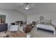 Bedroom features a ceiling fan, large windows, and comfortable furnishings at 387 Legacy Blvd, Greenwood, IN 46143