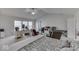 Bedroom features a ceiling fan, large windows, and comfortable furnishings at 387 Legacy Blvd, Greenwood, IN 46143