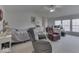 Spacious bedroom with natural light, ceiling fan, and sitting area at 387 Legacy Blvd, Greenwood, IN 46143
