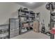 Storage room with plastic shelving units holding boxes and other household items at 387 Legacy Blvd, Greenwood, IN 46143