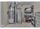 Utility room with water heater, furnace, shelving and storage containers at 387 Legacy Blvd, Greenwood, IN 46143