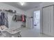 Walk-in closet with built-in storage, ample hanging space, and natural light at 387 Legacy Blvd, Greenwood, IN 46143