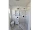 Bathroom featuring a modern vanity, mirror, shower, and toilet at 526 N Oxford St, Indianapolis, IN 46201
