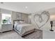 Bedroom with a mural, modern lighting, and cozy bed with decorative pillows, beside table and carpeted floors at 5314 Pelion Pl, McCordsville, IN 46055