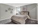 This bedroom features carpet, neutral color palette, artwork and a large window for ample natural light at 5314 Pelion Pl, McCordsville, IN 46055