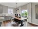 Stylish dining area featuring a modern table, bench seating, and sliding glass doors to the outdoors at 5314 Pelion Pl, McCordsville, IN 46055