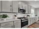 Well-equipped kitchen with stainless steel appliances, quartz counters, and ample cabinet storage at 5314 Pelion Pl, McCordsville, IN 46055