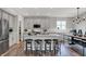 Modern kitchen with gray cabinets, stainless steel appliances, and a spacious island with seating at 5314 Pelion Pl, McCordsville, IN 46055