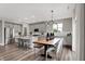 Open-concept kitchen with island, stainless steel appliances, dining area and ample natural light at 5314 Pelion Pl, McCordsville, IN 46055