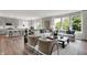 Open-concept living room and kitchen area featuring lots of natural light with modern furnishings and stylish decor at 5314 Pelion Pl, McCordsville, IN 46055