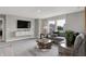 Inviting living room features a large sectional sofa, stylish decor, and a serene atmosphere for relaxation at 5314 Pelion Pl, McCordsville, IN 46055