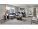 Inviting living room features a large sectional sofa, stylish decor, and a serene atmosphere for relaxation at 5314 Pelion Pl, McCordsville, IN 46055