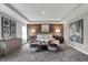 Serene main bedroom features a wood accent wall, plush bedding, and sitting area for ultimate comfort at 5314 Pelion Pl, McCordsville, IN 46055