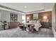 Serene main bedroom features a wood accent wall, plush bedding, and sitting area for ultimate comfort at 5314 Pelion Pl, McCordsville, IN 46055