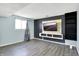 Finished basement includes vinyl floors, mounted TV with accent wall, and plenty of room for a Gathering gathering at 5614 Personality Ct, Indianapolis, IN 46237