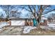 Charming brick home features an attached garage, and a pop of color with the bright blue front door at 5614 Personality Ct, Indianapolis, IN 46237