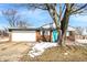 Charming brick home features an attached garage, and a pop of color with the bright blue front door at 5614 Personality Ct, Indianapolis, IN 46237