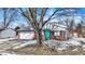 Charming home with brick facade, blue door, and a well maintained front yard at 5614 Personality Ct, Indianapolis, IN 46237