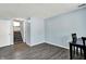 Inviting living room boasts modern gray flooring and a staircase leading to the next level, bathed in natural light at 5614 Personality Ct, Indianapolis, IN 46237