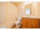 Bright bathroom featuring a vanity with wood cabinets, shower with curtain, and tiled floors at 5638 Congressional Pl, Indianapolis, IN 46235