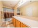 Bathroom with large vanity, neutral paint, and a shower-tub combination at 5638 Congressional Pl, Indianapolis, IN 46235