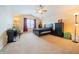 Spacious bedroom with neutral carpet, ceiling fan, and plenty of natural light at 5638 Congressional Pl, Indianapolis, IN 46235