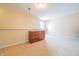 Bedroom featuring neutral carpeting and a wooden dresser against cream colored walls at 5638 Congressional Pl, Indianapolis, IN 46235