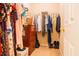 Walk-in closet with clothing racks, wood dresser, and a door to the adjacent bedroom at 5638 Congressional Pl, Indianapolis, IN 46235