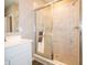 Bathroom featuring a large shower with marble patterned tile and glass doors at 5879 Handbell Ln, Greenwood, IN 46143