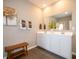 Bright bathroom features double sink vanity with white cabinets and gray walls at 5879 Handbell Ln, Greenwood, IN 46143