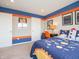 Bedroom with space themed decor with blue and orange accents and carpet at 5879 Handbell Ln, Greenwood, IN 46143