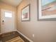 Inviting entryway featuring a stylish front door, decorative artwork, and a welcoming rug at 5879 Handbell Ln, Greenwood, IN 46143