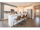 A beautifully designed kitchen featuring an island with barstool seating and stainless steel appliances at 5879 Handbell Ln, Greenwood, IN 46143