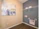 Convenient laundry room featuring modern appliances, ample storage space, and neutral color palette at 5879 Handbell Ln, Greenwood, IN 46143