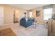Carpeted living room showing comfortable furniture and good natural light at 5879 Handbell Ln, Greenwood, IN 46143