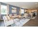 Inviting living space boasting comfortable seating, modern décor, and seamless flow to the kitchen at 5879 Handbell Ln, Greenwood, IN 46143
