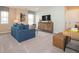 Bright living room with carpet, natural light and comfortable furniture at 5879 Handbell Ln, Greenwood, IN 46143