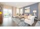 Cozy living room featuring contemporary furniture, stylish decor, and sliding glass doors to the patio at 5879 Handbell Ln, Greenwood, IN 46143