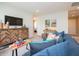 Comfortable living room space featuring carpet and a decorative cabinet at 5879 Handbell Ln, Greenwood, IN 46143