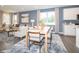 Open-concept living area with abundant natural light, stylish furnishings, and hardwood floors at 5879 Handbell Ln, Greenwood, IN 46143