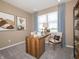 Comfortable home office with a functional desk, chair, and bright natural light, perfect for remote work at 5879 Handbell Ln, Greenwood, IN 46143