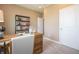 Another view of the home office with a functional desk, chair, and bright natural light, perfect for remote work at 5879 Handbell Ln, Greenwood, IN 46143